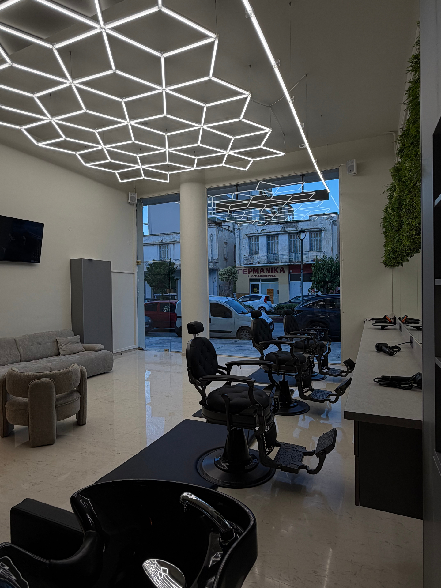 Studio 1 interior showing lounge and barber stations